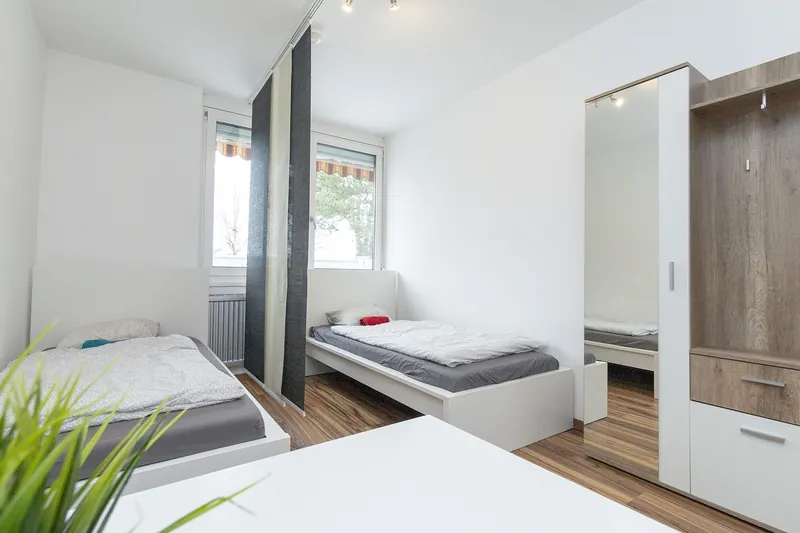 Schlafzimmer mit zwei Einzelbetten im Apartment Marchtrenk 42 m²